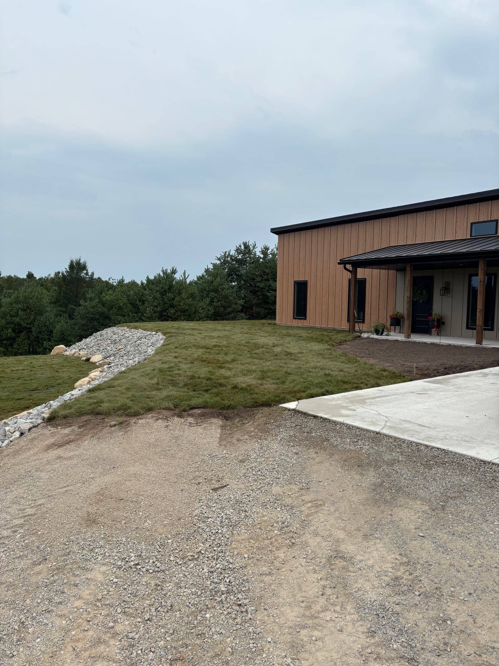 Gallery photos for Slope Washout Fixed With Stone, Drainage, and Fresh Sod: Image #4