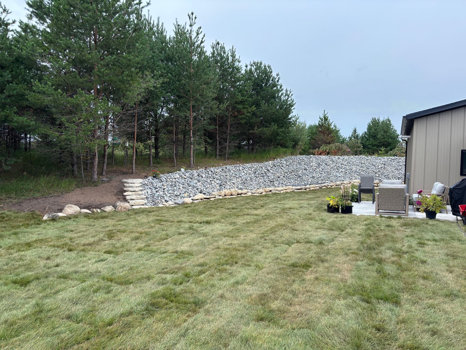 Gallery photos for Slope Washout Fixed With Stone, Drainage, and Fresh Sod: Image #2