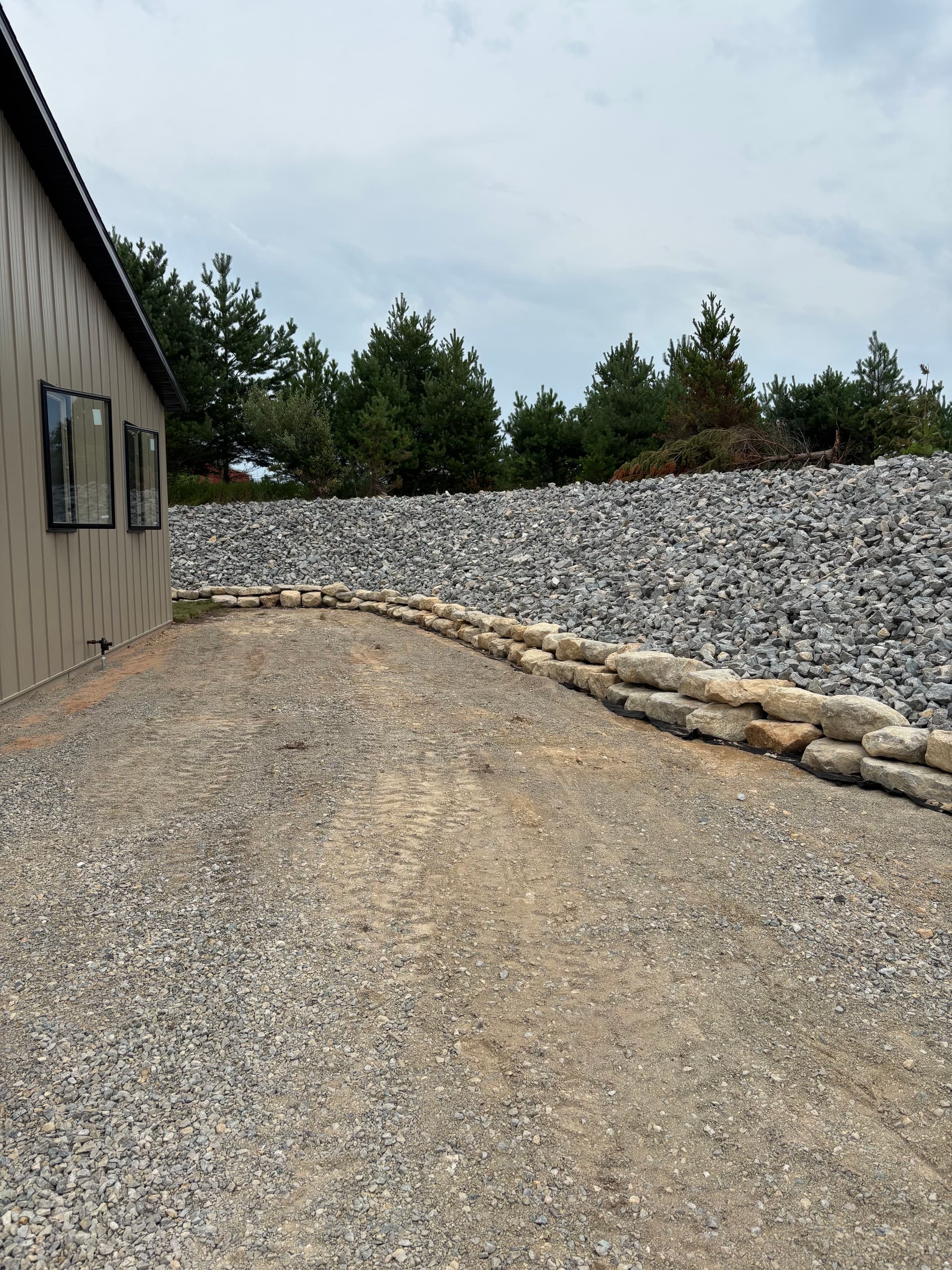Gallery photos for Slope Washout Fixed With Stone, Drainage, and Fresh Sod: Image #1