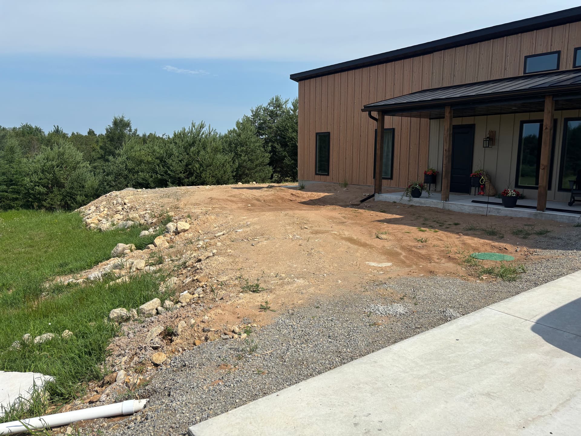 Gallery photos for Slope Washout Fixed With Stone, Drainage, and Fresh Sod: Image #5